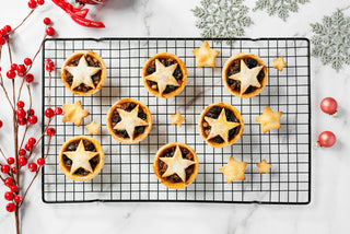 Mince pies on a wire rack 