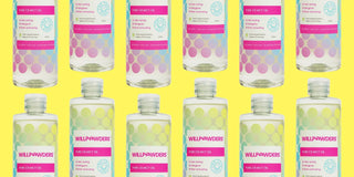 Multiple bottles of WillPowders MCT Oil on a purple background