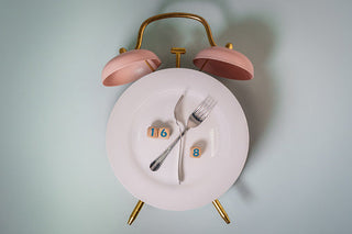 Alarm clock made out of forks and a plate